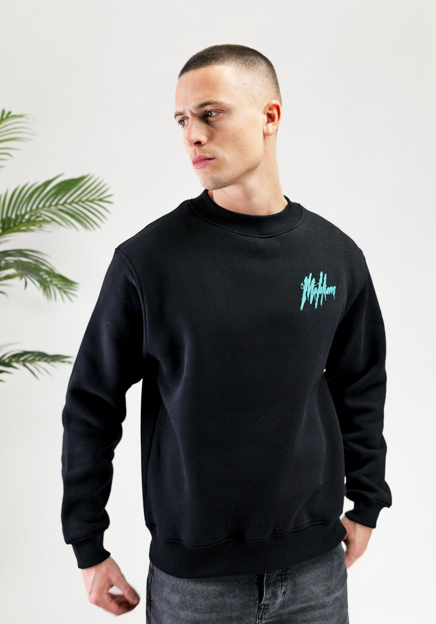 Cotton District MALELIONS SIGNATURE DRIP SWEATER BLACK